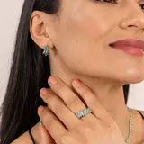 Aros de plata 925 con piedra rectangular de ónix paraiba.