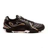 Championes de fútbol 5 Joma Dribling 2401, color negro con detalles en blanco y dorado. Capellada de PVC y textil con perforaciones VTS para mayor transpiración. Suela de caucho Durability con sistema Rotation y líneas Flexo para mayor flexibilidad y agarre en superficies indoor.