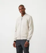 Chaqueta bomber azul marino lisa, con cierre frontal, cuello redondo y bolsillos laterales.