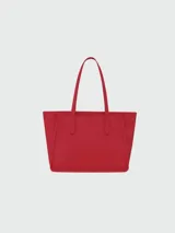 Cartera tipo tote de cuero negro con textura granulada, diseño minimalista, asas largas para hombro y compartimento principal amplio.