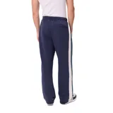 Pantalon de jogging azul marino con franjas laterales en verde y blanco, cintura elástica con cordón ajustable y logo de la marca bordado en la pierna.