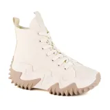 Zapatillas deportivas de caña alta color beige con suela chunky marrón.