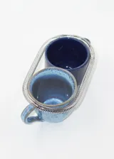 Pulsera rígida elastizada de acero quirúrgico hipoalergénico color plateado.