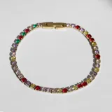 Pulsera dorada de acero con cristales redondos de muchos colores y cierre de cajita.