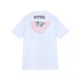 Remera negra de manga corta con cuello redondo, parte de una colaboración entre Under Armour y Tini. Presenta un estampado grande en el centro con la palabra "FUTTTURA" en tipografía plateada brillante y una imagen de Tini Stoessel en un ambiente oscuro y estrellado.