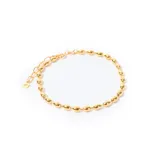 Pulsera dorada con cuentas alargadas.