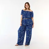 Pantalón ancho de punto crepé color azul con estampado floral en tono claro, de tiro alto y corte holgado.
