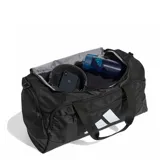 Bolso deportivo Adidas modelo Tra Def Duf S, color negro con el logo de la marca en blanco. Cuenta con asas de mano, correa ajustable para el hombro y múltiples bolsillos con cierre.