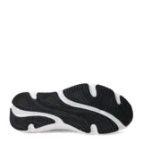 Championes de running Under Armour modelo Rogue 6, color negro con suela blanca. Presentan diseño de malla transpirable, refuerzos laterales y logo de la marca en el lateral y la lengüeta.