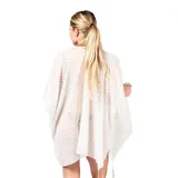 Kimono blanco de gasa calada con diseño geométrico, calce amplio y fluido, escote abierto y terminación en cordones con borlas decorativas.