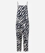 Mono largo de sastrería marca Cortelle, confeccionado en crepé con elastano, con estampado animal print de cebra en tonos beige y negro. Presenta escote recto, tirantes finos regulables, corte wide leg en las piernas y un cinturón ancho ajustable en la cintura.