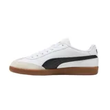 Championes Puma 9T blancos con detalles en verde y beige, suela color caramelo.