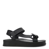 Sandalias Miss Carol modelo Jeli, color negro, con diseño estilo Teva, plataforma plana y tiras ajustables de goma.