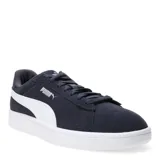 Championes urbanos Puma modelo Smash 3.0, color azul marino con la icónica franja lateral en blanco. Confeccionados en gamuza, cuentan con cierre de cordones y suela de goma blanca.