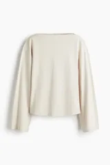 Top de algodón con escote bote, diseño de hombros caídos y mangas largas holgadas.