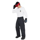 Pantalón técnico Rip Curl de la línea Anti Series, color negro, diseñado para condiciones climáticas adversas. Presenta un corte recto, cintura con cierre de botones y trabillas para cinturón, ofreciendo funcionalidad y resistencia.