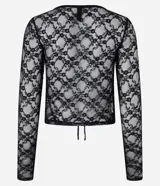 Blusa de manga larga confeccionada en encaje floral transparente, con escote en V y cierre frontal mediante lazos.
