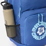 Mochila Rip Curl de 33 litros, color azul, con compartimento principal con cierre, bolsillo frontal con estampa circular de la marca y flor, y bolsillos laterales de red.