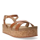 Sandalias de cuero color marrón caramelo con plataforma de corcho, tiras cruzadas en el empeine y cierre con hebilla metálica en el tobillo.