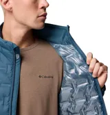 Campera puffer Columbia con tecnología HeatSeal y forro termorreflectante Omni-Heat. Presenta cierre frontal completo, cuello alto con protección de barbilla, bolsillos laterales con cremallera y diseño de celdas térmicas sin costuras.