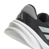 Championes de running Adidas Supernova Stride 2, color negro con detalles plateados y suela blanca.
