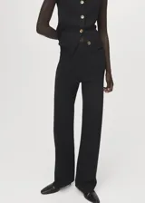 Pantalón de punto fino negro, de tiro medio y diseño recto con cintura elástica sin cierre.