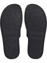 Sandalias negras tipo slide de doble tira con logo jacquard en relieve.