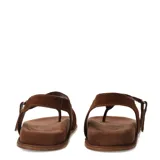 Sandalias de cuero marrón, tipo thong con tira separadora de dedos y cierre con tira ajustable en el talón.