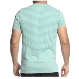 Remera deportiva de manga corta color naranja melange, con cuello redondo y logo de la marca Umbro estampado en blanco en el pecho.