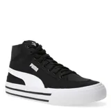 Championes urbanos Puma modelo Court Classic Vulc Mid FS, de caña media, confeccionados en lona negra con la icónica franja lateral en color blanco. Presentan cierre de cordones, cuello acolchado y suela vulcanizada blanca con líneas decorativas negras.