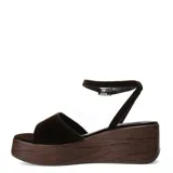 Sandalias de plataforma tipo zueco con tira ancha y pulsera ajustable al tobillo, confeccionadas en material textil de textura aterciopelada en color marrón, con base de plataforma efecto madera.