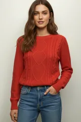 Sweater de algodón color azul marino, de manga larga y cuello redondo, con diseño de punto trenzado en el frente y los laterales.