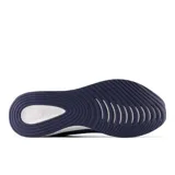 Championes de running New Balance modelo Lowky, color azul marino con logo naranja y suela blanca con detalles moteados.