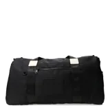 Bolso grande negro con doble asa de mano y correa larga regulable. Tiene un bolsillo frontal con cierre y un aplique rectangular con la inscripción "Be Kind" repetida tres veces.