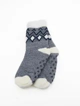 Medias térmicas de tejido de punto con interior de sherpa, diseño estampado con patrón geométrico en tonos azul y blanco, y suela antideslizante.