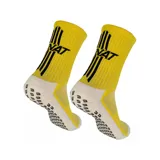 Medias deportivas amarillas con apliques de gel antideslizante en la planta del pie y logo de la marca en negro.