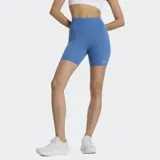 Short deportivo de mujer New Balance Harmony, color azul vibrante, de tiro alto y corte ciclista, con logo reflectante en la pierna.