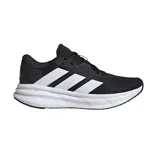 Championes de running Adidas Galaxy 7 W, color negro con las tres rayas distintivas de la marca en blanco. Cuentan con mediasuela Cloudfoam para amortiguación y suela de TPU.