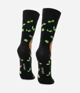 Par de medias negras de caña alta con estampado de Scooby Doo y Shaggy disfrazado de Scooby Doo.
