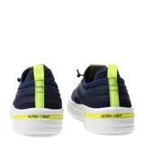 Championes urbanos Democrata modelo Ulie, color azul marino con detalles en amarillo neón. Presentan una estructura de malla transpirable con refuerzos sintéticos, sistema de cordones y suela blanca de goma con diseño texturizado.