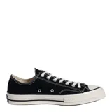 Championes de lona negra con puntera de goma, suela de plataforma de goma en color crema con detalles en negro y cordones blancos.