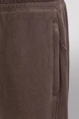 Pantalón jogger relaxed fit de Zara Athleticz confeccionado en tejido de algodón color marrón, con cintura elástica ajustable mediante cordón en contraste, bolsillos laterales y bajo con puño elástico.