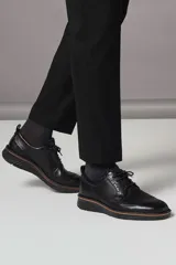 Zapato de vestir Ecco St.1 Hybrid de cuero negro con cordones, detalles brogue y suela de goma con tecnología ECCO FLUIDFORM™ Direct Comfort.