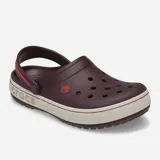 Zueco Crocs modelo Crocband Heritage, color negro con banda lateral en tono crema. Presenta correa de talón pivotante bicolor, diseño con textura pronunciada y detalles de costura, fabricado en espuma Croslite ligera.