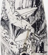 Pollera midi de viscosa y lino color crudo, con estampado de paisajes modernistas, nudo lateral y corte al bies.