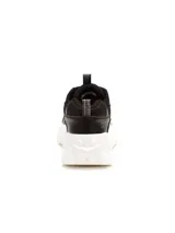 Championes Cat modelo Intruder Lite Vent, de diseño robusto con capellada en combinación de cuero sintético y malla técnica en color negro. Presenta una suela de plataforma dentada en color blanco, con logo de la marca en el lateral y tiradores en lengüeta y talón.