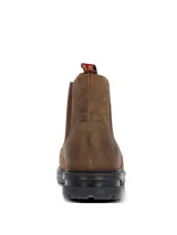 Botín estilo Chelsea color marrón oscuro, confeccionado en cuero con paneles laterales elásticos. Presenta una suela robusta de goma y EVA con tecnología de absorción de impactos y una presilla trasera con detalle de bandera.