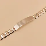Pulsera de eslabones tipo barbada con placa central lisa, fabricada en plata 925 con acabado pulido brillante.