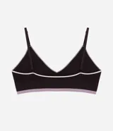 Soutien top seamless texturizado color marrón oscuro con detalles en rosado y ribete blanco, tirantes finos regulables y copas desmontables.