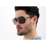 Lentes de sol INVU modelo B1008E, con montura metálica color gris plomo y lentes polarizadas color marrón.